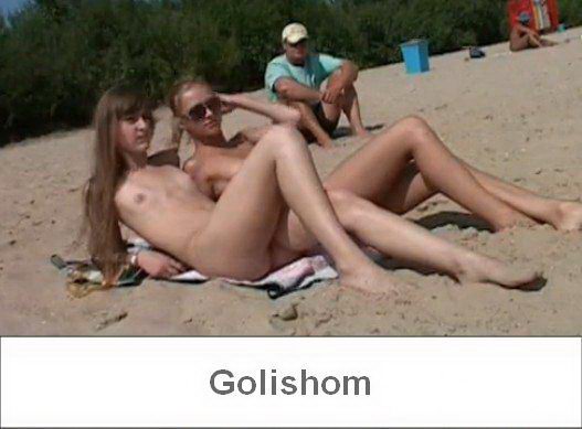 Two beautiful nudists on the beach