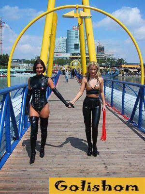 Girls walk on the bridge in interesting costumes