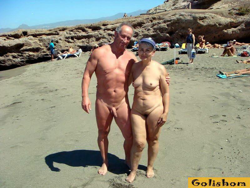 Nudist couples on the beach photos