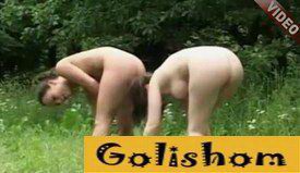 Naturist girls play football in nature video