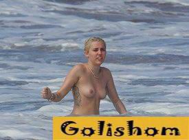 Miley Cyrus goes topless with Schwarzenegger's son