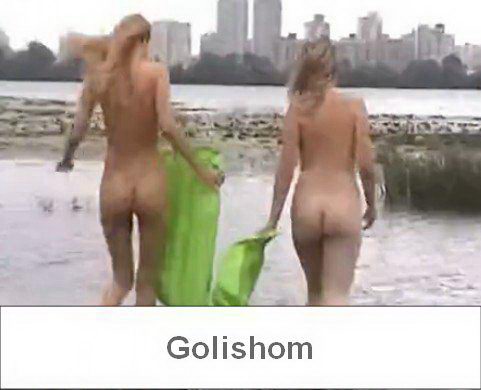 Two nudist girls on a wild beach