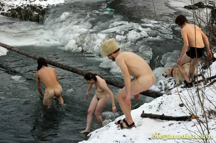 Winter swimming of nudists in the river