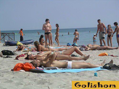 Many nudists on the beach in Kazantip