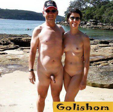Naked nudist couples on the sea photos
