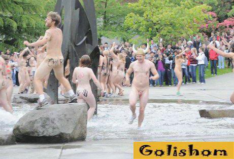 Nudists staged a dance around the fountain