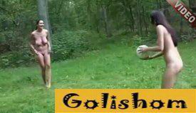 Young nudists play volleyball in nature video
