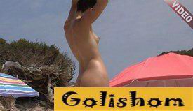 Leggy nudist with her boyfriend on the beach video