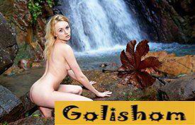 Charming nudism at the waterfall