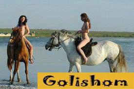 Two nudists ride horses