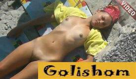 Nudist sunbathing in the sun by the sea video