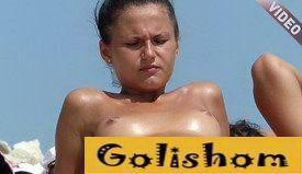 Beautiful nudist sunbathing on a wild beach video