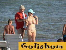 Nudists on the beach in summer
