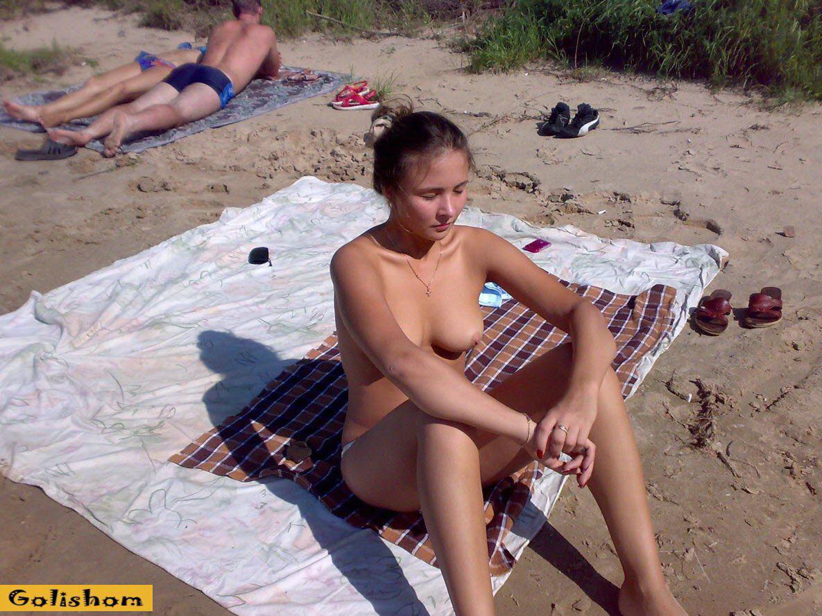 My wife is on vacation sunbathing topless-Naked