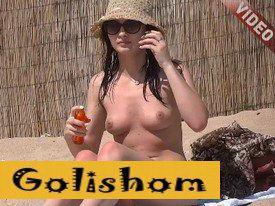 Lonely nudist on a deserted beach-video