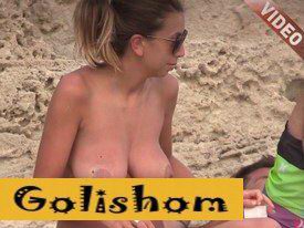 Fleshy breasts on the beach-video