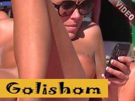 Naked nudists sunbathing on the beach-HD video