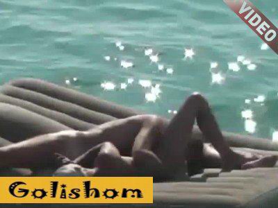 A couple of nudists on an air mattress-video