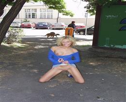 Curly blonde bares her pussy and tits on the street