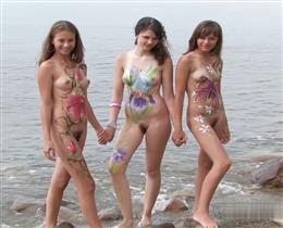 Young chicks naked on the beach