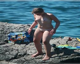 Nudist youth - on the beach without swimsuits